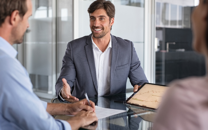 retirement planner talking to a physician about their retirement plan