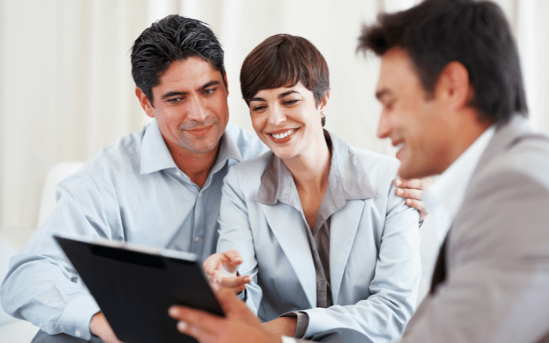couple talking to retirement planner in San Diego about their long-term care costs