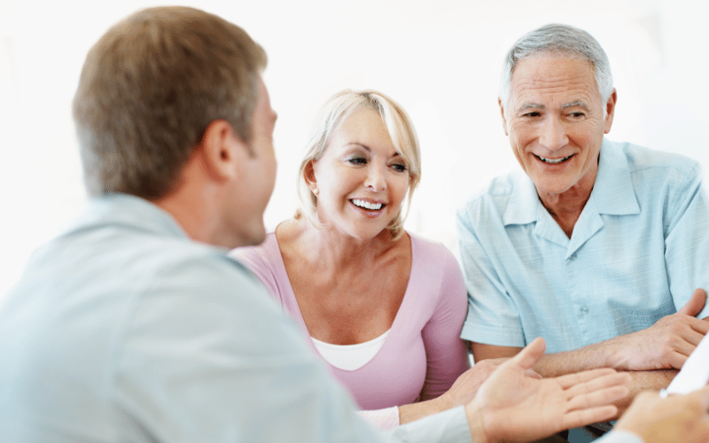 couple talking to a retirement planner about their long-term income strategy