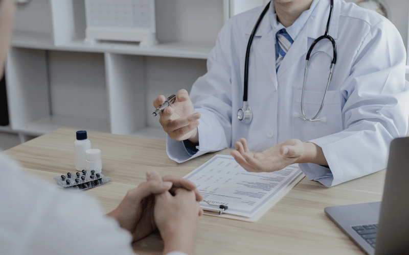 doctor discussing with patient the difference between medicare and medicaid