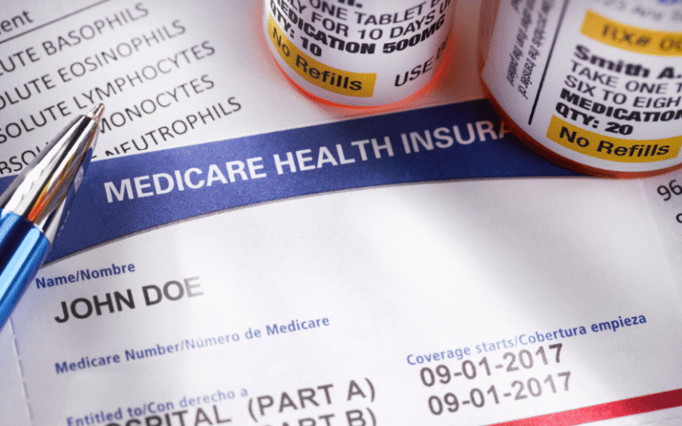 a closeup of a medicare card and various prescription bottles next to it