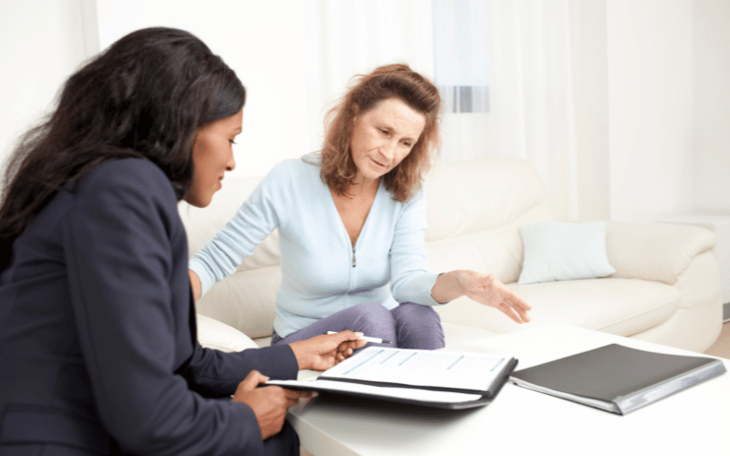 woman sitting with financial fiduciary advisor about long-term care
