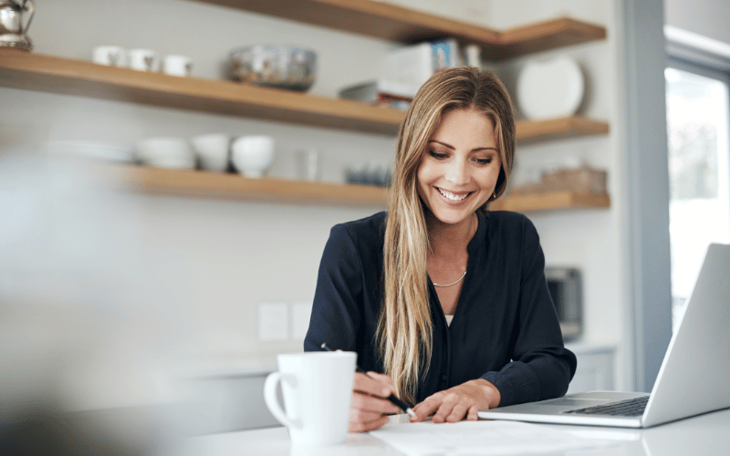woman sitting at her desk with her laptop planning how to finance her long-term care